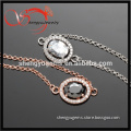 14K rose gold plated/platinum plated bracelet with oval charm pendant